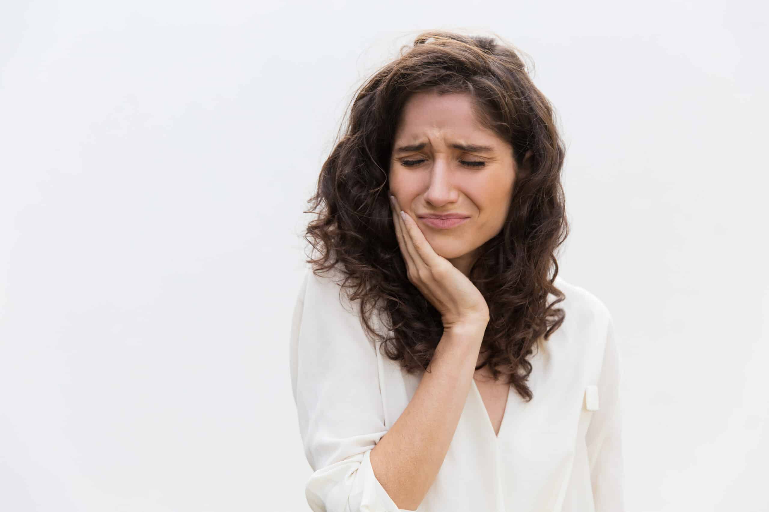 Frustrated unhappy woman suffering from toothache